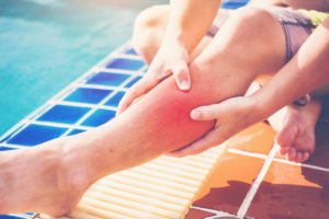 man with hurt leg after a swimming pool accident