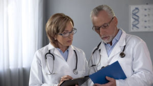 two doctors looking at a patient chart