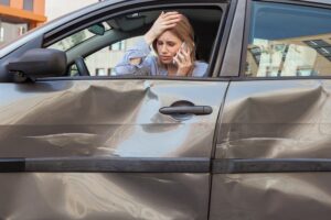 sad woman after car accident