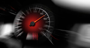 car speedometer marking driving over 150 miles per hour